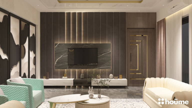 A modern living room with beige sofas, a marble-style TV wall, and gold accents. C