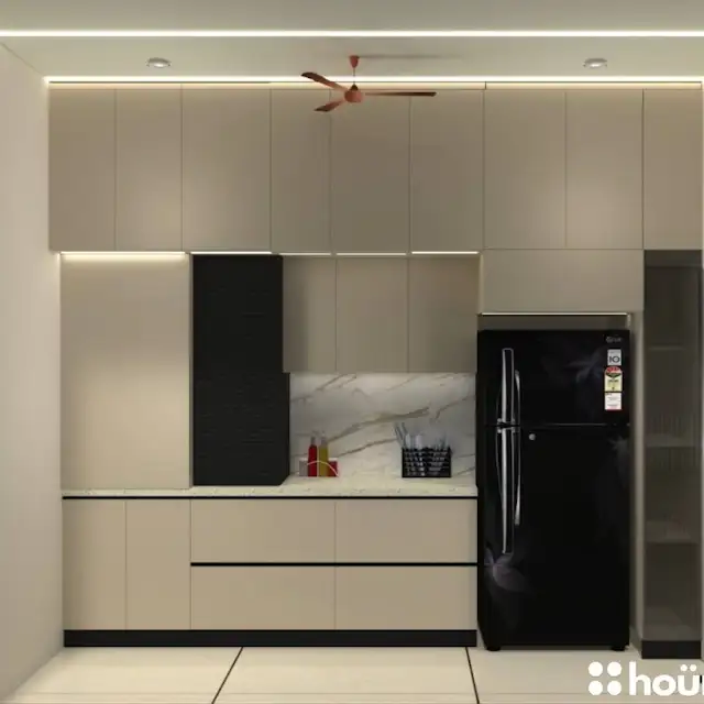 A contemporary kitchen featuring sleek beige cabinets, a contrasting black backsplash, and integrated appliances. B