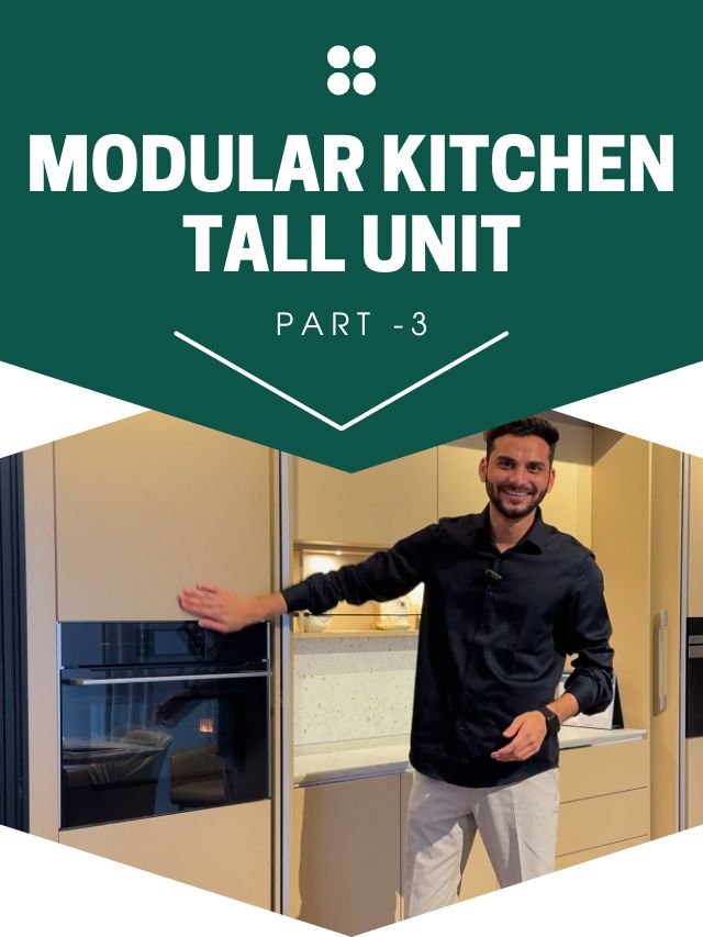 A modern kitchen featuring tall cabinets that extend from the countertop to the ceiling, providing ample storage.