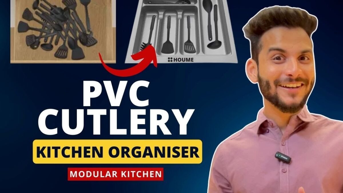 A modular kitchen drawer with an organized cutlery tray, showcasing various compartments for different utensils.