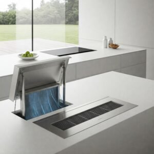 A minimalist, modern kitchen with a downdraft ventilation system seamlessly integrated into the island cooktop.