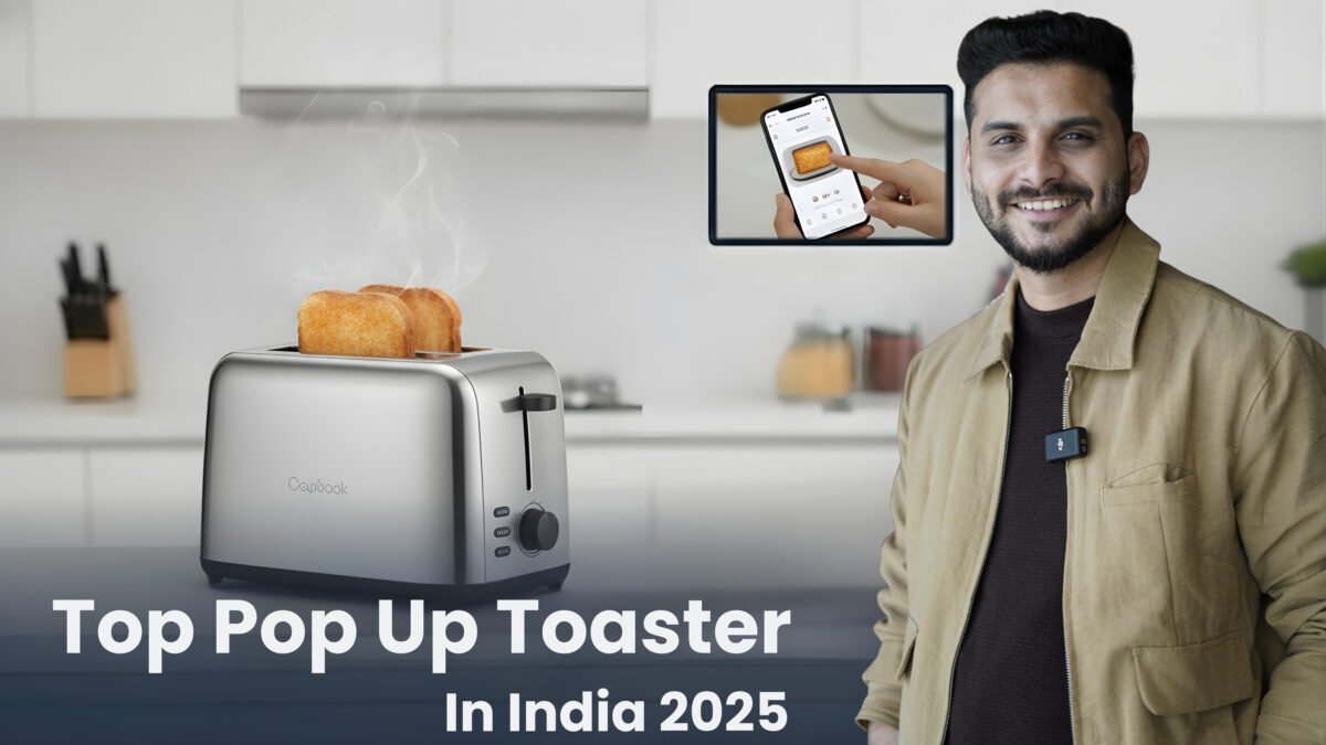 A close-up of a modern, silver and black pop-up toaster on a clean kitchen counter, actively toasting bread. A man (Sourabh) in a professional beige jacket gestures toward the appliance. An inset image highlights a control panel or dial. The bold title, "Top Pop-Up Toaster In India 2025" is visible at the bottom.