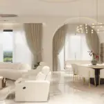 Cream curved seating and a dining arch — living room design, view 2